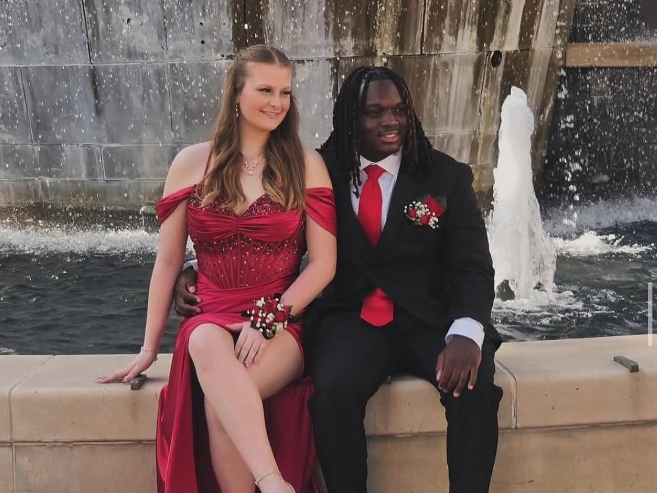 Deep red rose corsage and boutonniere worn for prom